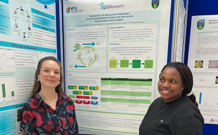 Researchers stand by poster at Environ2025